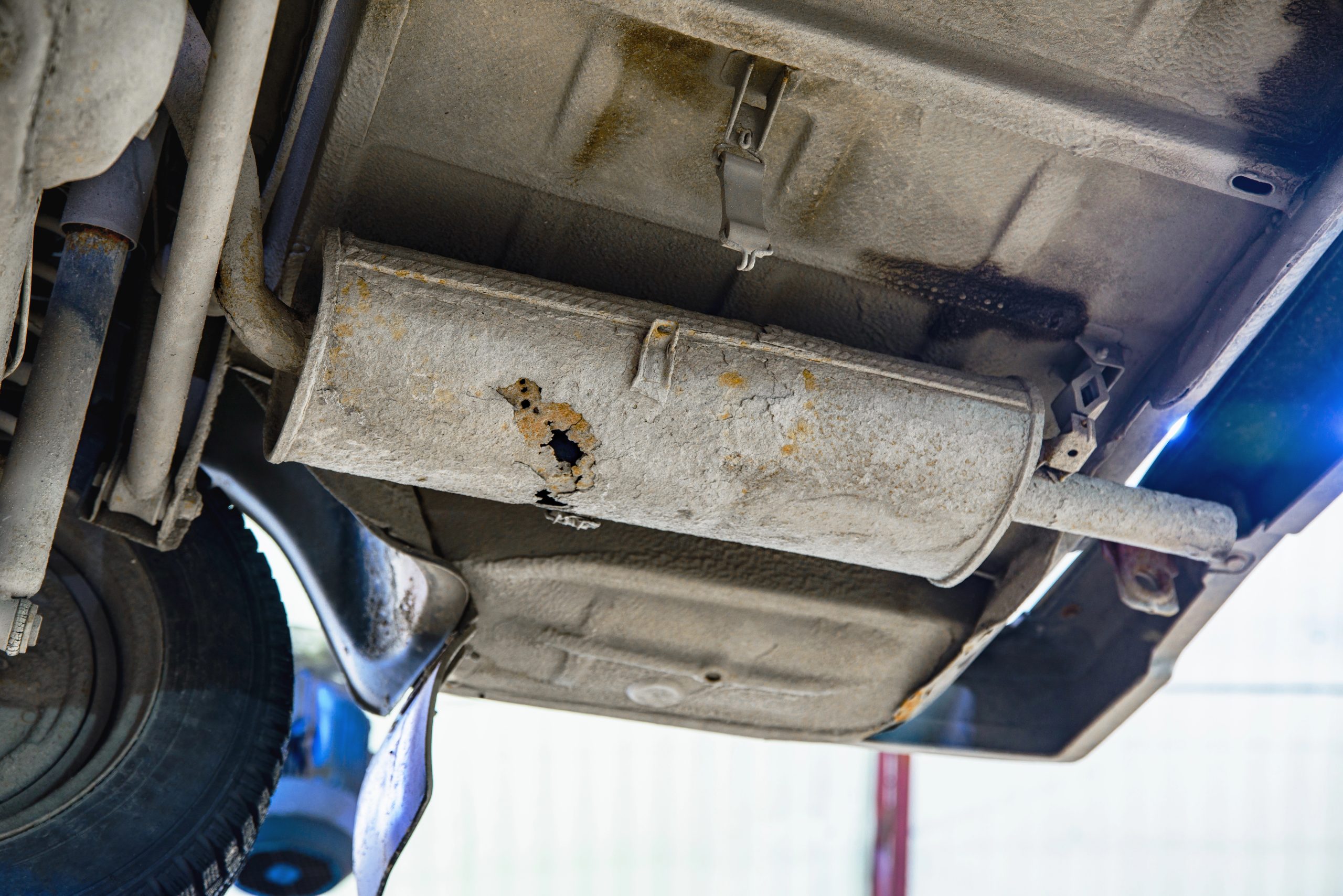 Old car muffler with shallow depth of field