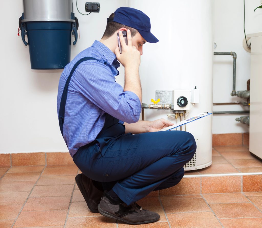 Technician servicing an hot-water heater